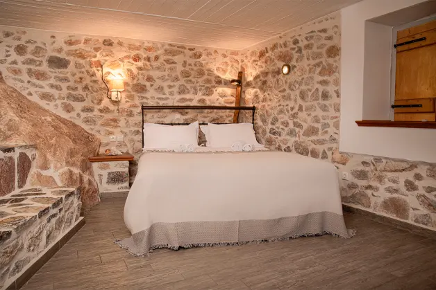 A bedroom carved in rock, to get back in touch with nature in you holidays in Hydra Island